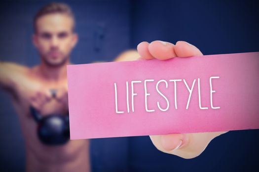 The word lifestyle and young woman holding blank card against 