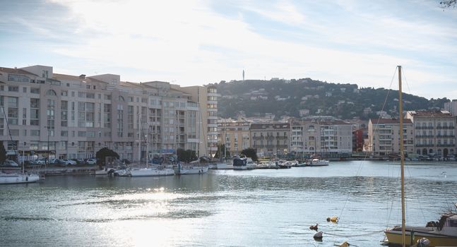 Sete, France - January 4, 2019: view of the marina in the city center where pleasure boats are parked on a winter day