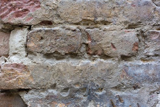 Wall pattern with bricks and cement, background texture