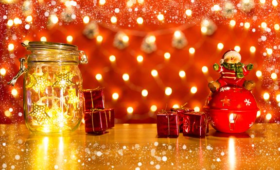 Christmas lights in a transparent jar and lights in background