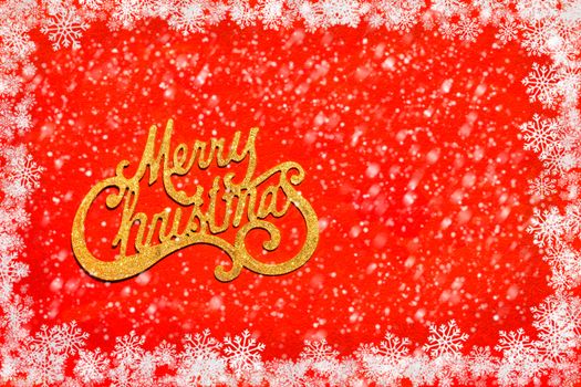 Merry Christmas on red background with snowflakes frame and snow over it