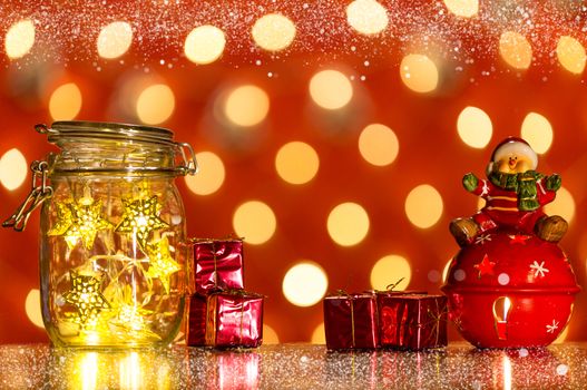 Christmas lights in a transparent jar and lights in background