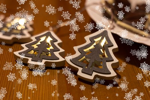 Christmas tree lights on a table and big snowflakes