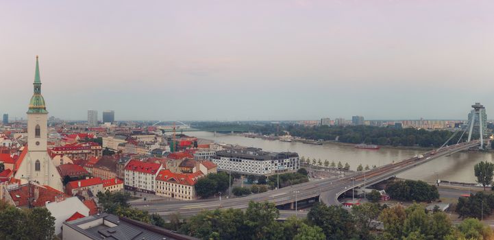 Panoramic view of Bratislava city with St. Martin's Cathedral and Danube river, retro colors