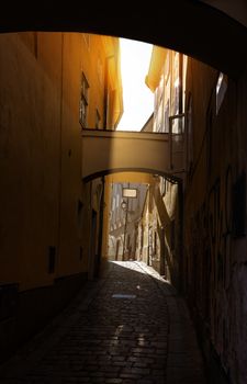 Narrow street in Bratislava city center, low light athmosphere