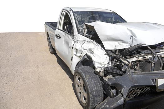 Front of white color car with pick up damaged and broken by accident on road parking can not drive any more. Save with clipping path