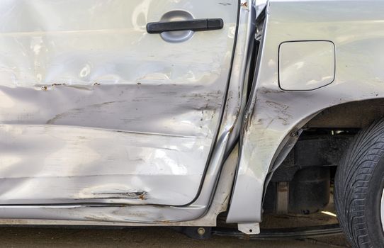 Car crash. Beside the light grey color pick up car have scratch from damage. Close up scratch