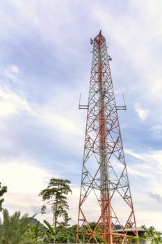 mobile phone communication and network signal repeater antenna tower with blue sky background