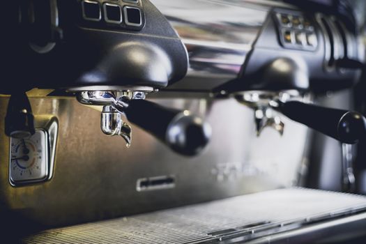 Close-Up of coffee machine in the coffee shop. len blur effect. Process with vintage style