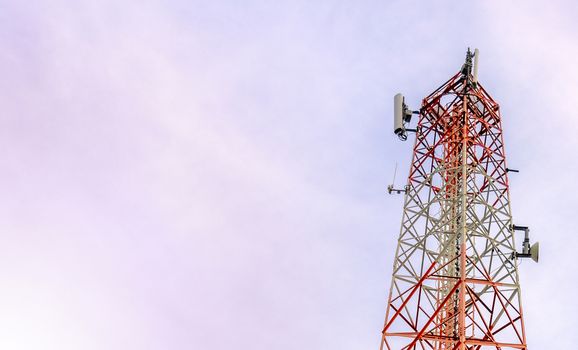 mobile phone communication and network signal repeater antenna tower with blue sky background. With copy space for text or design