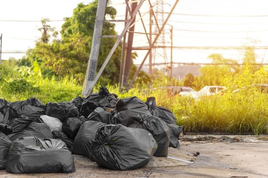 Big and many plastic garbage bag on streets with garbage sitting on ground