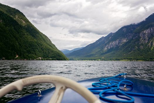 Sailing electric boat on Hallstatter See lake, Austria, Europe