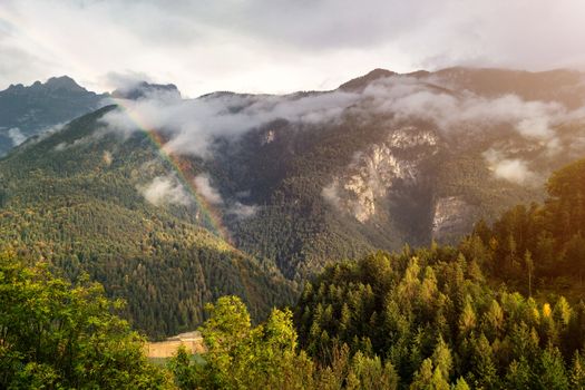 Autumn colors over the hills after the rain, Cadore, Italy, dolomites