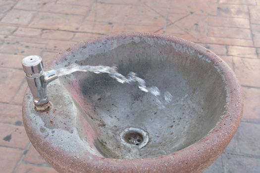 Decorative drinking fountain on a public street park in Spain