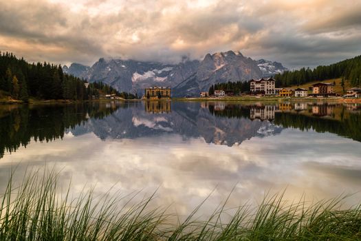 Msurina lake with putna sorapis mountains reflection in the morning.