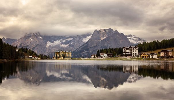 Panoramic view of Putna Sorapis peeks from Misurina lake with beautiful reflections.