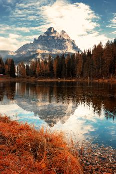 Famous Tre Cime di Lavaredo (Drei Zinnen) reflection on Antorno lake dring late autumn. Italy, Europe