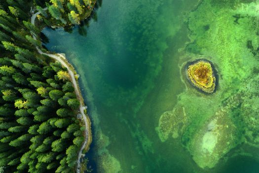 Misurina lake from above, aerial view of crystal clear water.