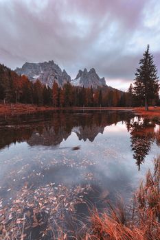 Beautiful fall morning with mountain refection at Antorno lake, Italy, Europe