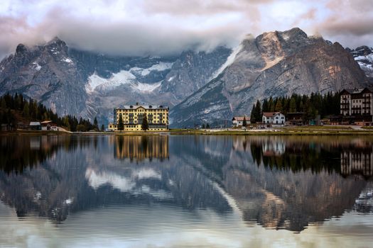 View of Punta Sorapis mountain of the Dolomites in the morning with the reflection on the famous lake Misurina at Cortina d'Ampezzo in Italy