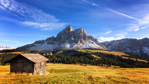 Mountain hut with beautiful peak on the background at passo Erbe, Dolomites, Italy