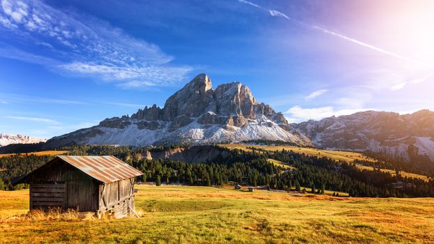 Mountain hut with beautiful peak on the background at passo Erbe, Dolomites, Italy