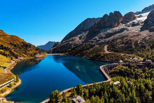 Lago Fedaia (Fedaia lake), an artificial lake and a dam near Canazei city, located at the foot of Marmolada massif, as seen from Viel del Pan refuge, Dolomites, Trentino, province of Belluno, Italy