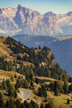 Morning panorama of Gardena mountain pass or Passo Gardena. Looking north towards the road and valley in a sunny weather.