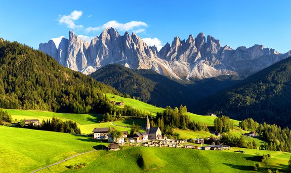 Panoramic view of Geisler or Odle dolomites mountain peaks in Santa Maddalena (Sankt Magdalena) in the Val di Funes in Italy (Italia)