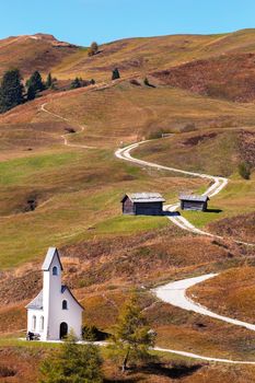 Nature landscape with nice church in a mountain pass in Italy Alps.