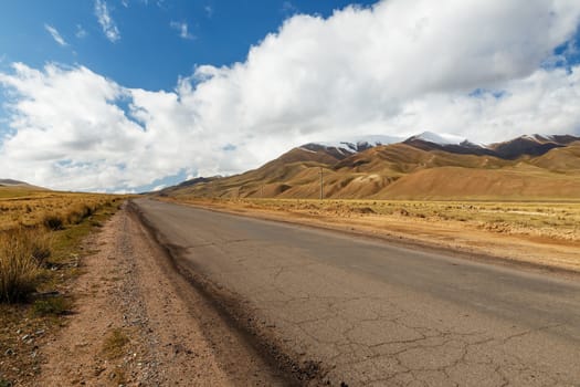 A367 highway passing in the Naryn region of Kyrgyzstan, near the village of Uzunbulak in Kochkor District.