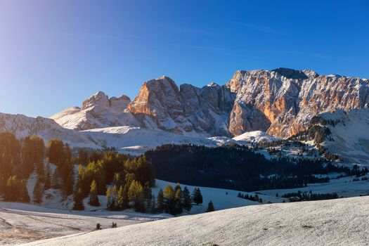 Sunny morning scene of Compaccio village, Seiser Alm or Alpe di Siusi location, Bolzano province, Italy, Europe. Picturesque summer view of Dolomiti Alps. Beauty of countryside concept background.