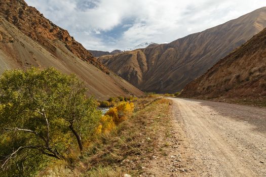 mountain road along the Kokemeren river in Naryn Region of Kyrgyzstan.