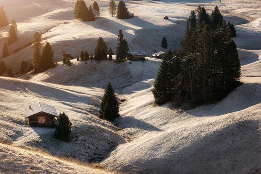 Misty landscape view in Alpe di Siusi or Seiser Alm at beautiful sunrise, Dolomites mountain, Italy