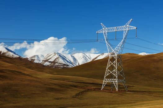 electricity pylon in the mountains. power line in the mountains of Kyrgyzstan in the Naryn region.