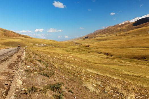 A367 highway passing in the Naryn region of Kyrgyzstan. road to the Kyzart pass.