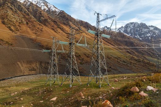 electricity pylon in a mountain gorge in Kyrgyzstan. power lines in the mountains