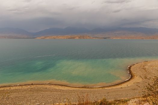 Toktogul Reservoir in the territory of the Toktogul district of the Jalal-Abad region of Kyrgyzstan.