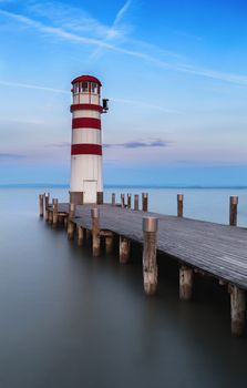 Lighthouse and ponds at the lake early in the morning