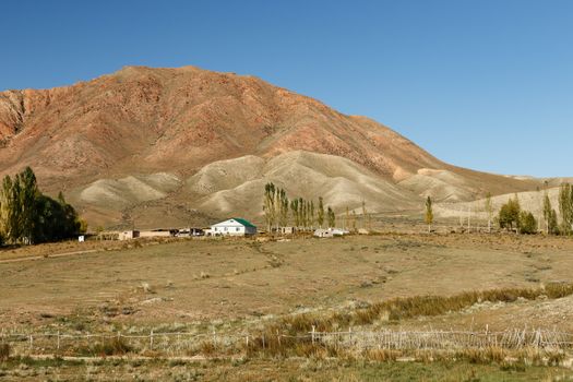 house in the mountains of Kyrgyzstan on the southern shore of Lake Issyk-Kul.
