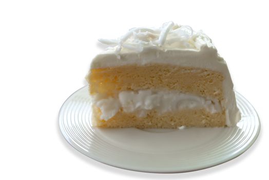 Coconut cream cake with slice Coconut on top isolate on white background. Save with cliping path.