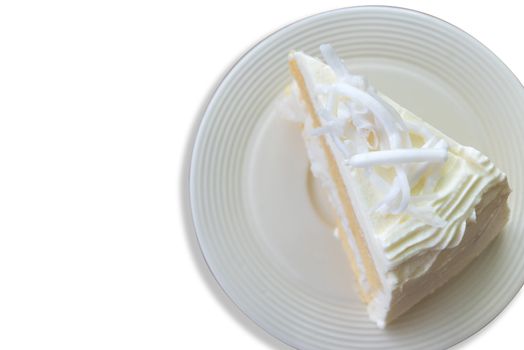 Top view close up coconut cream cake with slice Coconut on top isolate on white background.
