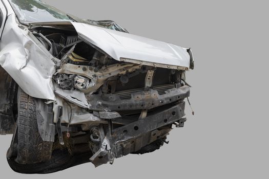 White color car damaged and broken by accident . Isolate on gray background. Save with cliping path