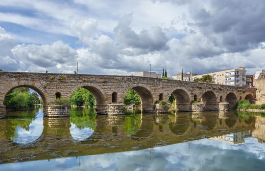 View of the Roman bridge of Merida with its reflection on the Guadiana river. Merida. Spain.The Archaeological Ensemble of Merida is declared a UNESCO World Heritage Site Ref 664