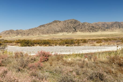 state border between Kazakhstan and Kyrgyzstan, Chuy Valley. View of Kazakhstan from Kyrgyzstan