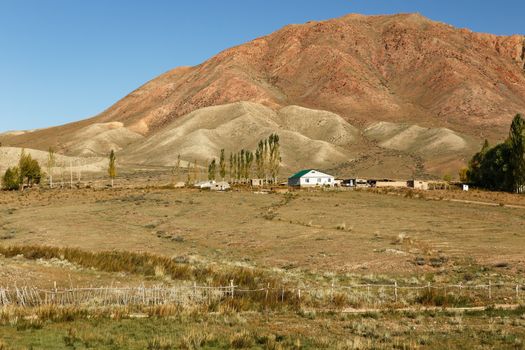 village house in the mountains of Kyrgyzstan on the southern shore of Lake Issyk-Kul