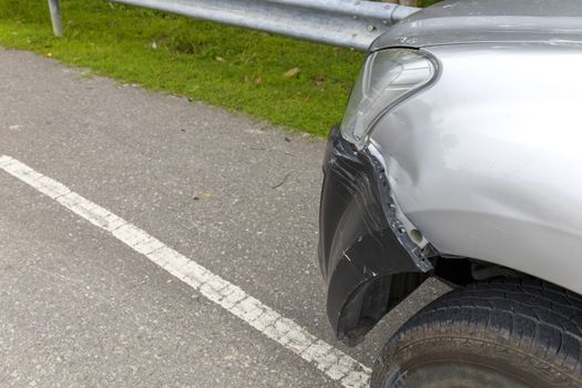 Front of light gray color car with pick up have big damaged and broken by accident on road can not drive any more park for wait insurance officer. With copy space for text or design