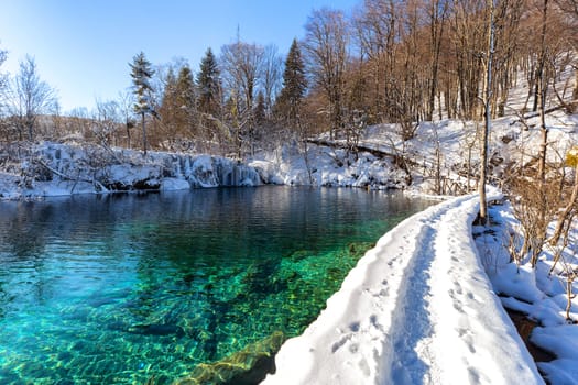 Path thru snow at plitvice lakes during winter, Croatia, Europe