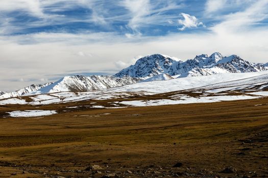 snowy mountain peaks on the Ala Bel pass, Bishkek Osh Highway M41 in Kyrgyzstan
