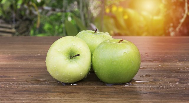 Green apple on table